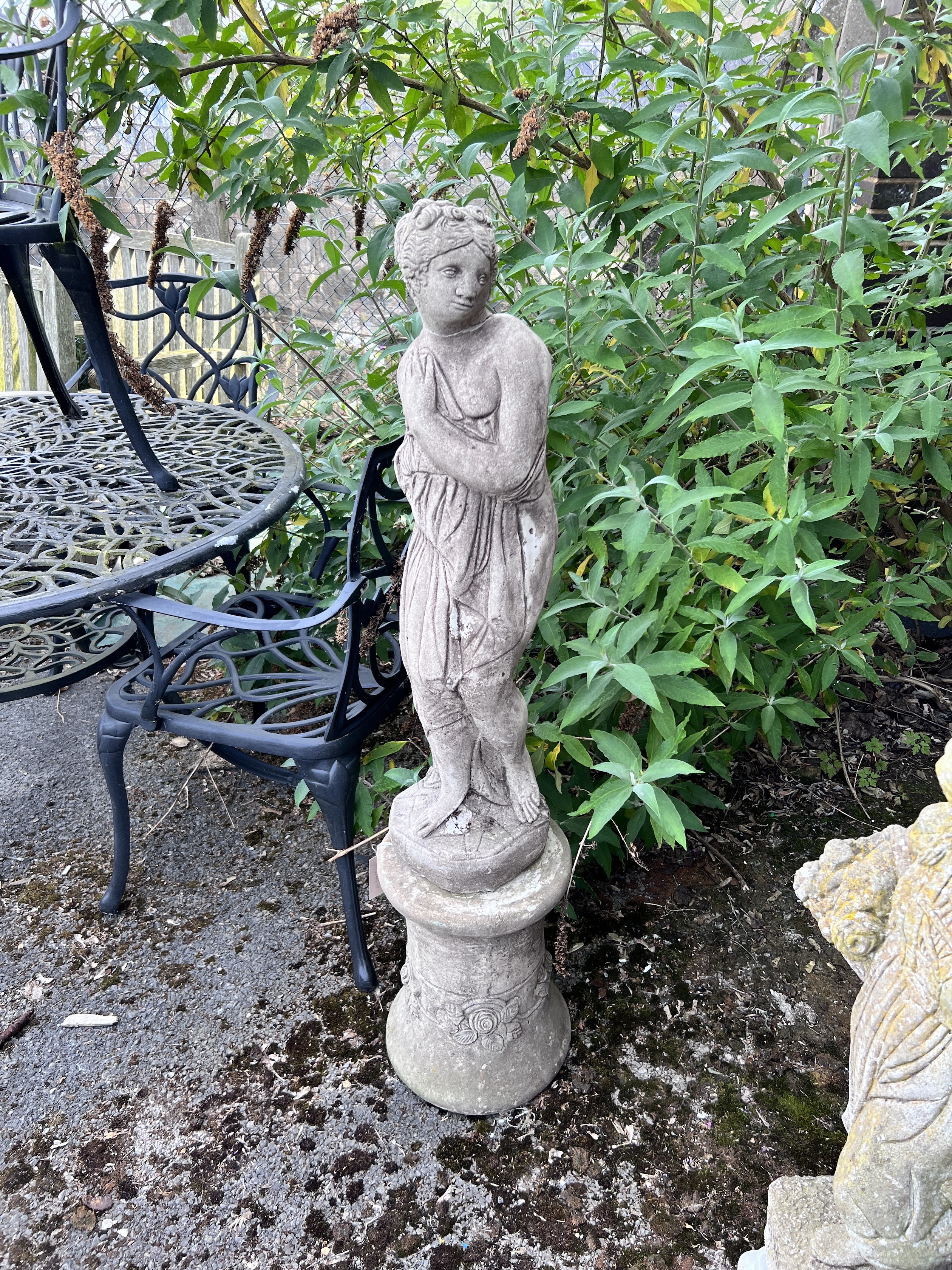 A reconstituted stone classical garden figure of a girl, on pedestal base, height 121cm